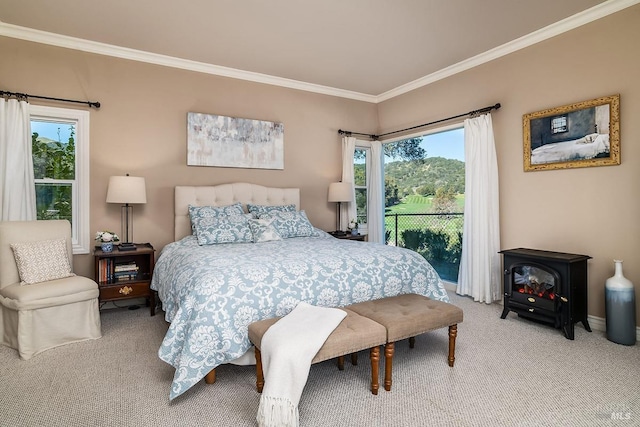 bedroom featuring carpet floors, a wood stove, and ornamental molding