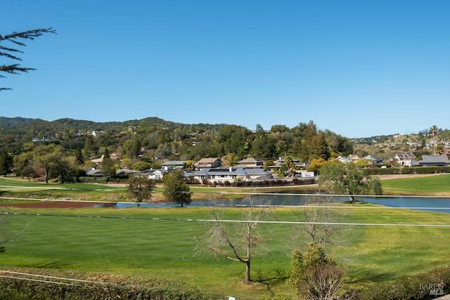 view of home's community with a water view and a residential view