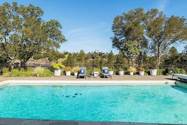 community pool featuring fence