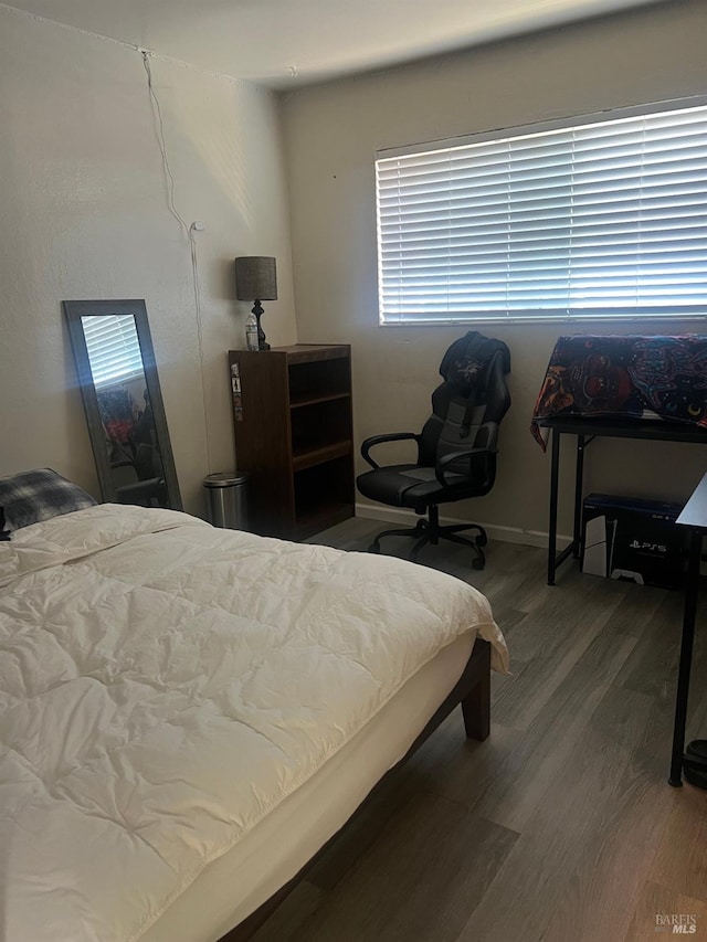 bedroom featuring wood finished floors