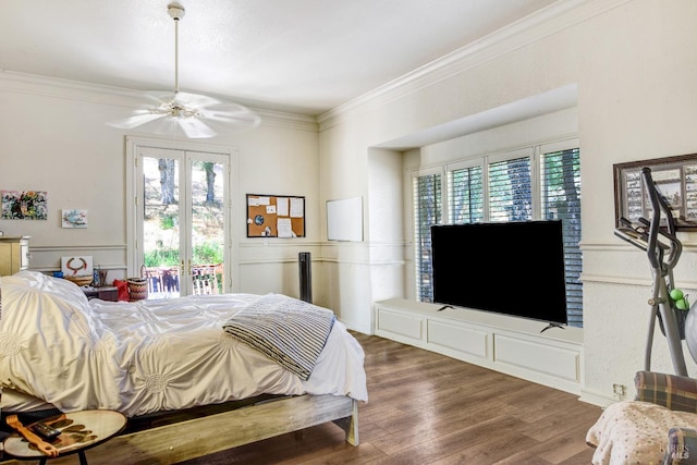 bedroom with access to outside, crown molding, wood finished floors, and french doors