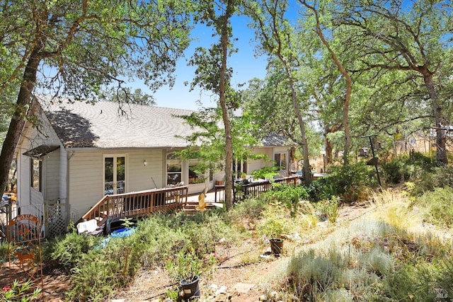 rear view of house with a deck