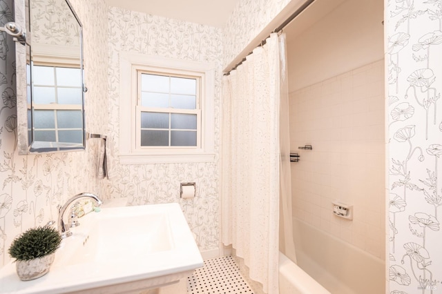 full bath with shower / bathtub combination with curtain, tile patterned floors, a sink, and wallpapered walls