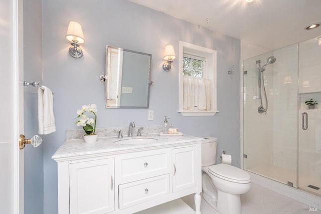 full bath with tile patterned floors, a shower stall, toilet, and vanity