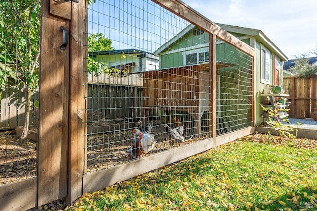 view of outdoor structure with fence