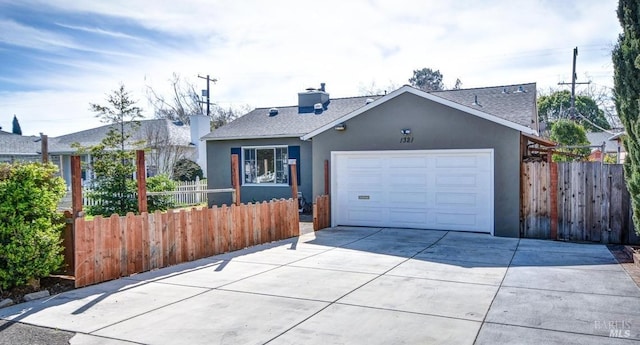 single story home with an attached garage, fence, and stucco siding