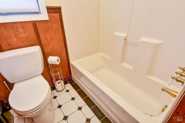 bathroom featuring toilet and a shower