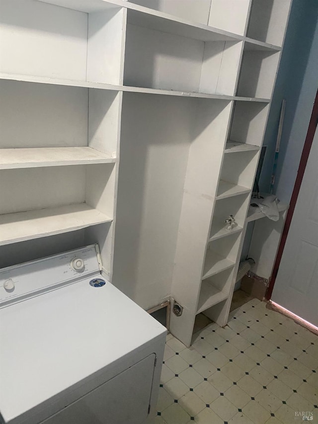 laundry room featuring laundry area, washer / clothes dryer, and light floors