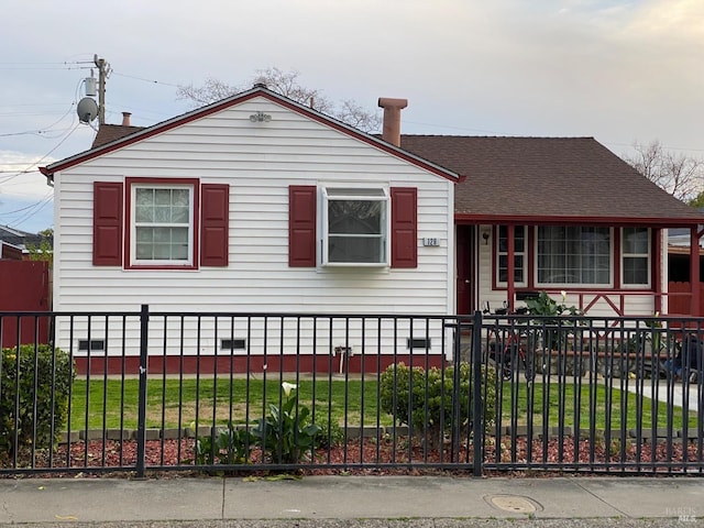 view of front facade with a fenced front yard