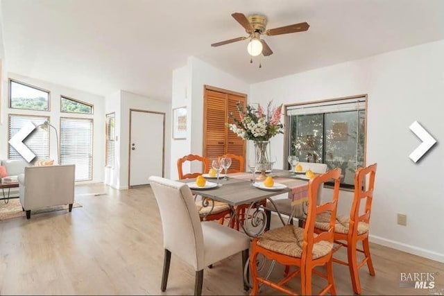 dining room with light wood finished floors, a ceiling fan, and baseboards