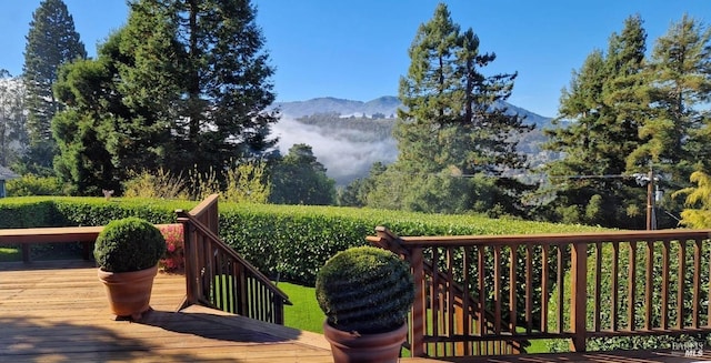 wooden deck with a mountain view