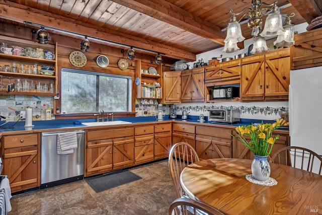 kitchen with brown cabinetry, freestanding refrigerator, a sink, black microwave, and dishwasher