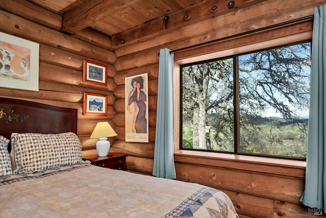 bedroom featuring wooden ceiling, multiple windows, and beamed ceiling