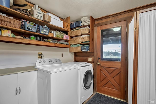 washroom featuring washing machine and dryer and laundry area