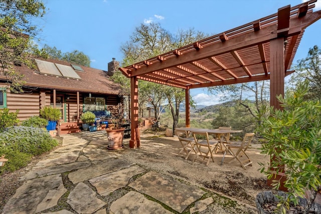 view of patio / terrace featuring outdoor dining area and a pergola