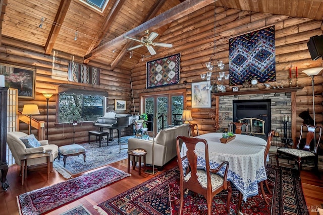 dining area featuring wood ceiling, wood finished floors, and beamed ceiling