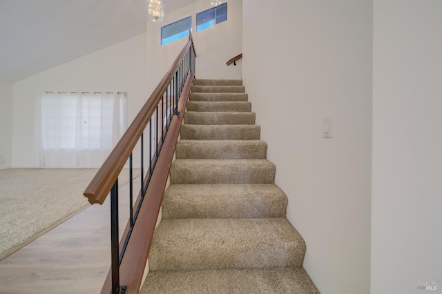 staircase with wood finished floors