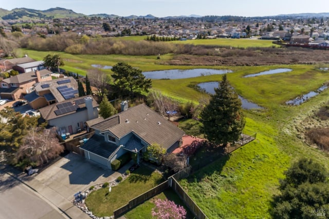 birds eye view of property featuring a water view and a residential view