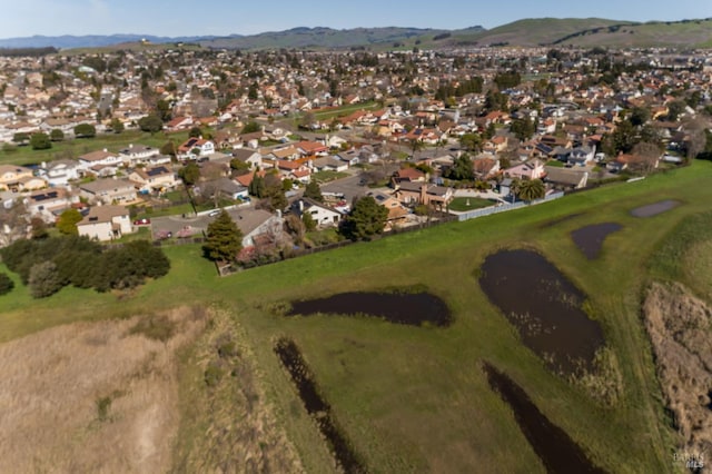 birds eye view of property with a mountain view