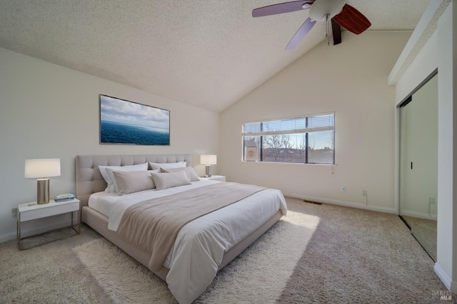 bedroom featuring baseboards, light colored carpet, ceiling fan, a textured ceiling, and high vaulted ceiling