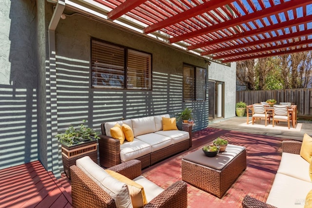 deck featuring an outdoor hangout area, outdoor dining area, fence, and a pergola