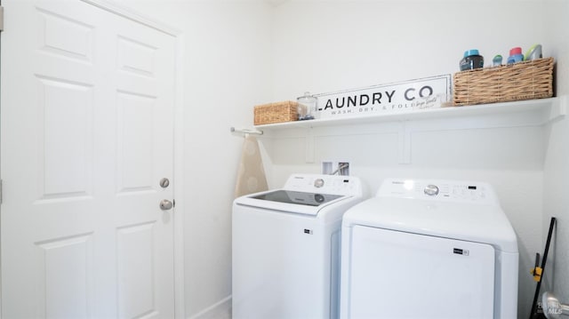 laundry room with washer and dryer and laundry area