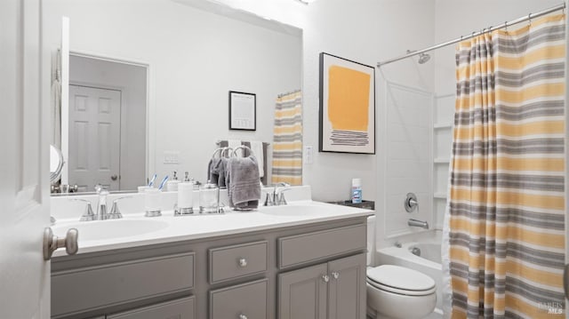 bathroom featuring shower / bath combo, a sink, toilet, and double vanity