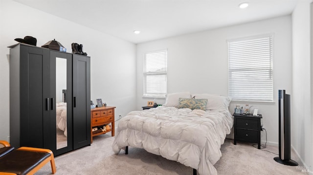 bedroom featuring light carpet, baseboards, and recessed lighting