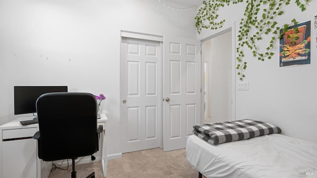 bedroom featuring light colored carpet