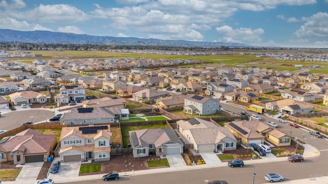 drone / aerial view featuring a mountain view and a residential view