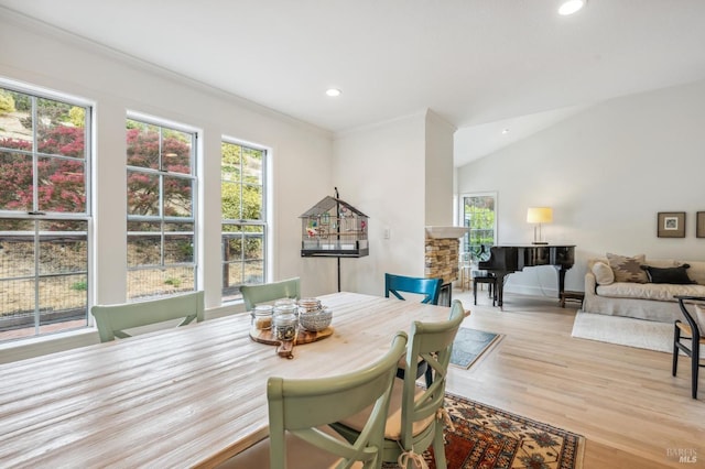 dining room featuring light wood-style flooring, ornamental molding, and recessed lighting