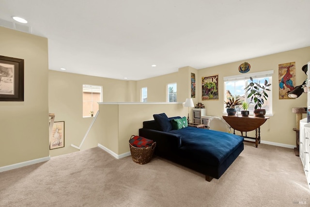 sitting room with light carpet, recessed lighting, an upstairs landing, and baseboards