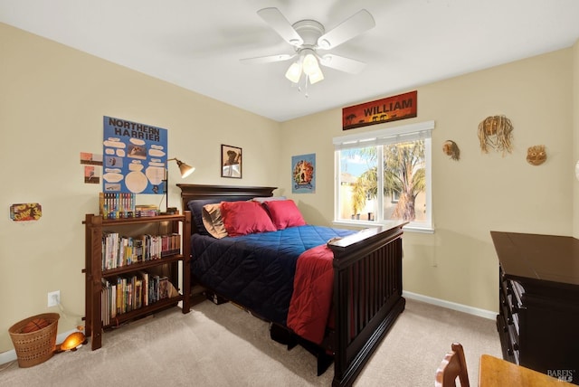 bedroom featuring light carpet, ceiling fan, and baseboards