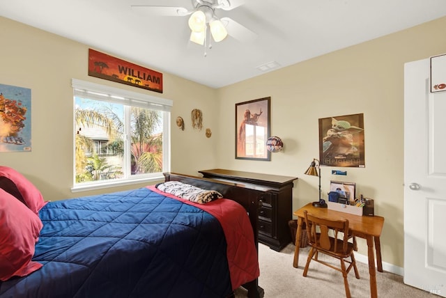 bedroom featuring baseboards, ceiling fan, visible vents, and light colored carpet