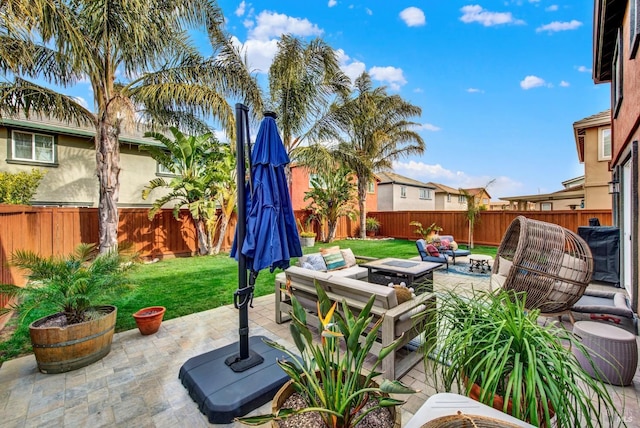 view of patio featuring an outdoor living space with a fire pit and a fenced backyard