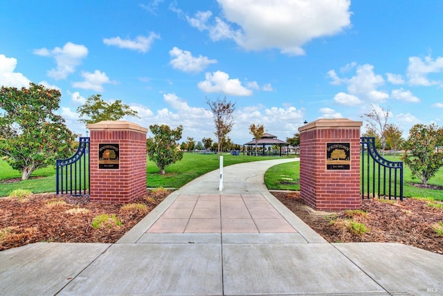 view of property's community featuring a gazebo and a lawn