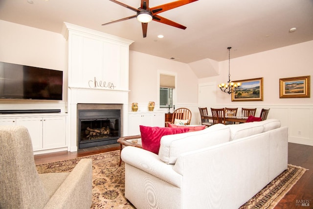 605 Center St, Healdsburg, CA 95448 - living area with a fireplace with flush hearth, a decorative wall, recessed lighting, dark wood-type flooring, and ceiling fan with notable chandelier