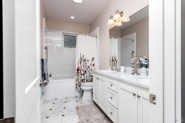 full bathroom featuring toilet, double vanity, marble finish floor, tiled shower / bath, and a sink