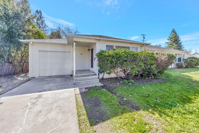 ranch-style home featuring a garage, driveway, stucco siding, fence, and a front yard