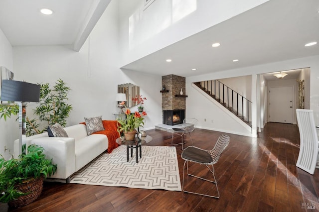 living room featuring a large fireplace, wood finished floors, and recessed lighting