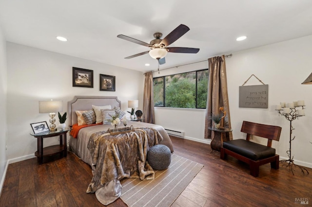 bedroom featuring recessed lighting, baseboards, dark wood finished floors, and baseboard heating