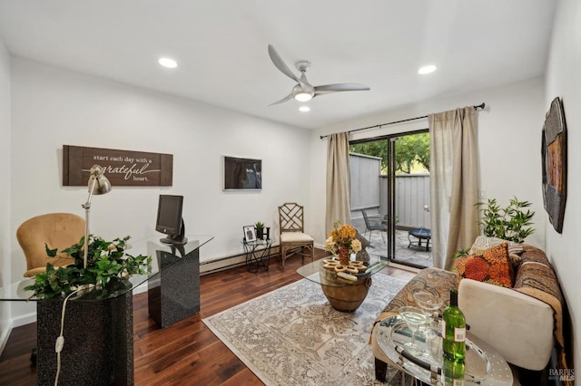 living room featuring dark wood-style flooring, baseboard heating, a ceiling fan, and recessed lighting