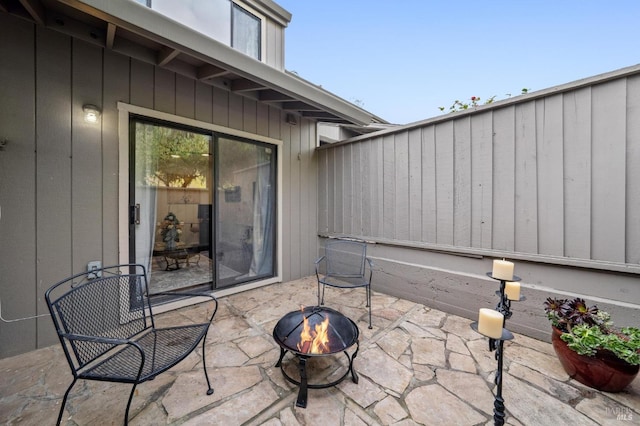 view of patio with an outdoor fire pit