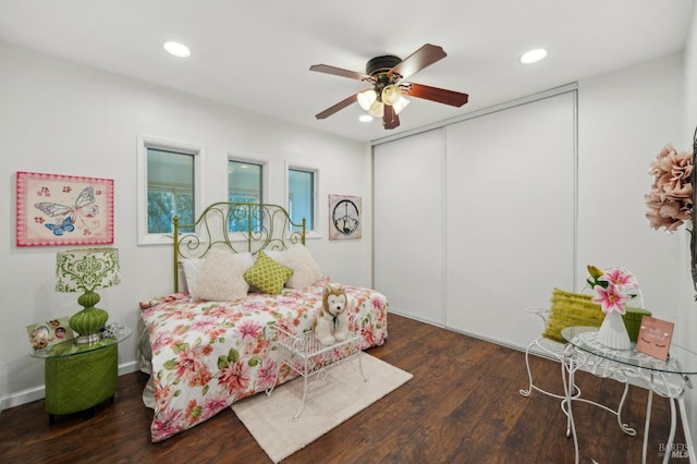 bedroom featuring ceiling fan, dark wood-type flooring, a closet, and recessed lighting