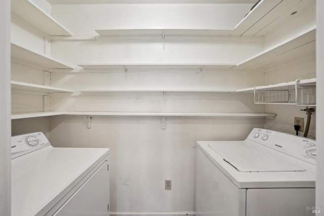 laundry room with washing machine and dryer and laundry area