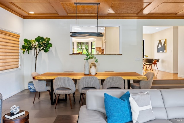 dining space with baseboards, coffered ceiling, crown molding, and recessed lighting