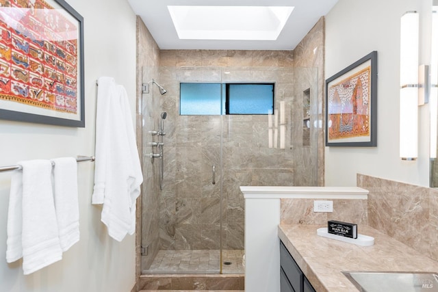 full bath with a shower stall and vanity