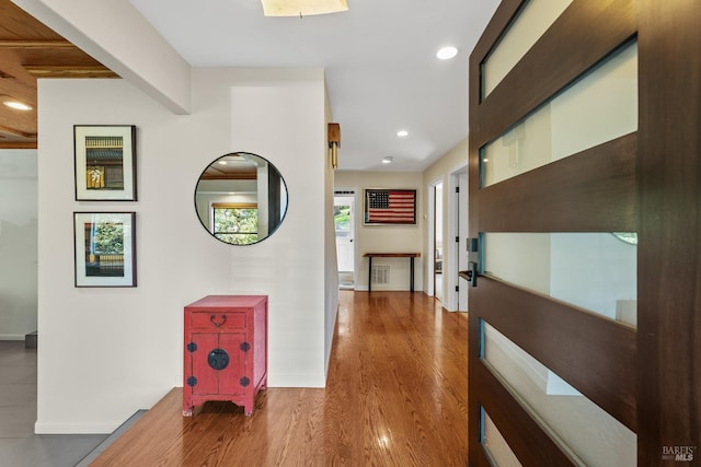 corridor with recessed lighting, baseboards, and wood finished floors