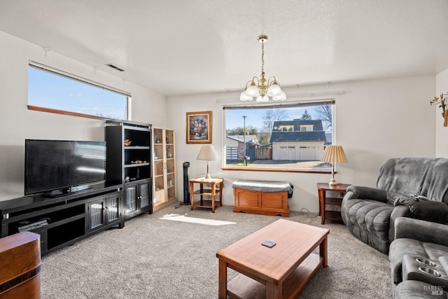 carpeted living area featuring a textured ceiling, visible vents, and a notable chandelier