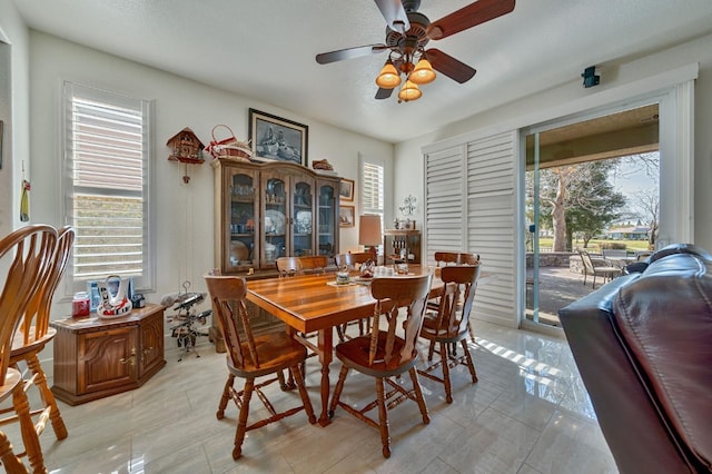 dining room with ceiling fan